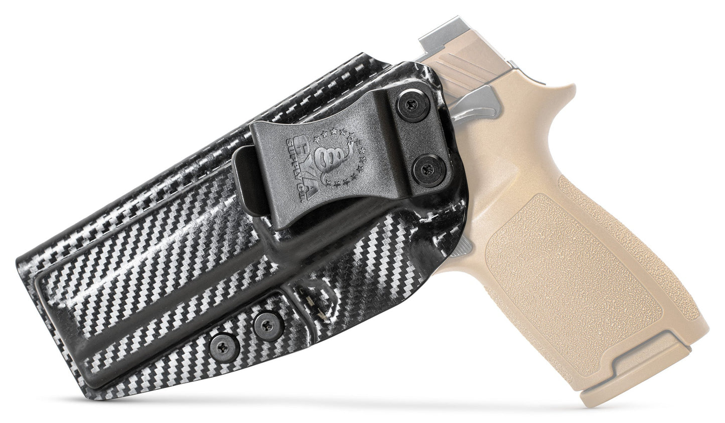 CYA Holster in carbon steel with a black clip on a tan sig sauer m17 handgun