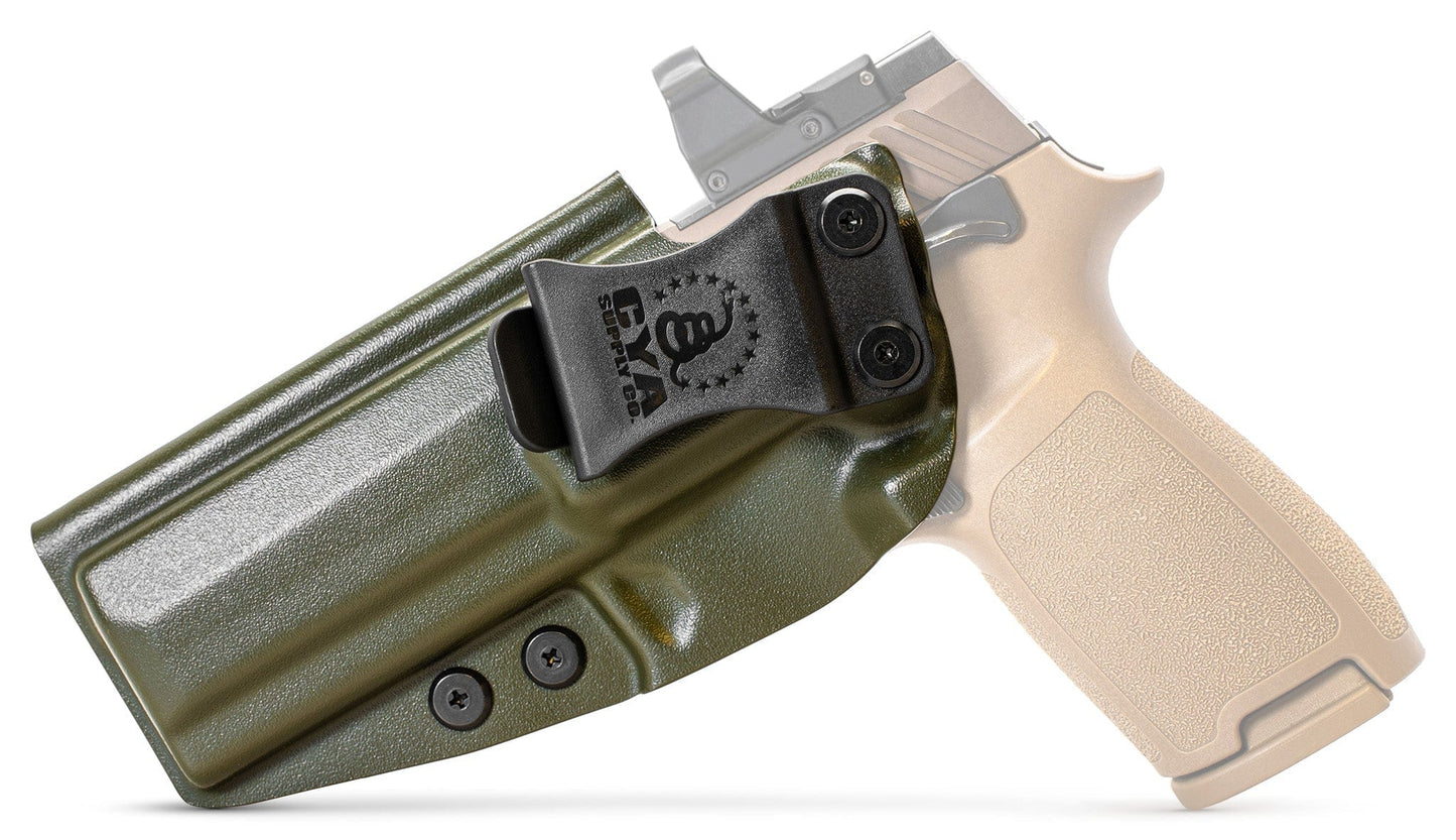 CYA Holster in od green with a black clip on a tan sig sauer m17 handgun