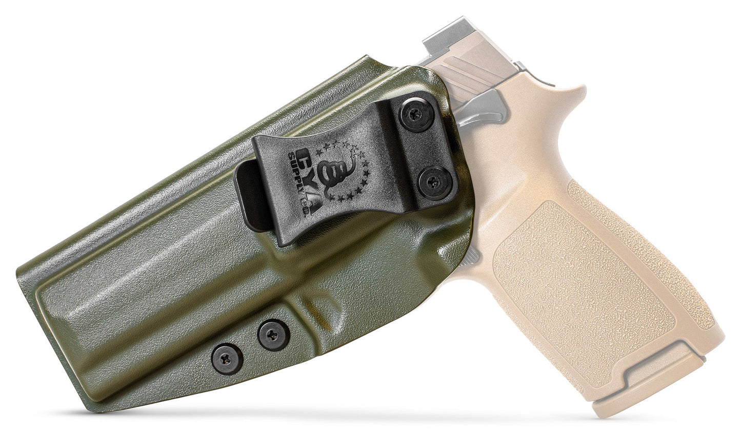 CYA Holster in od green with a black clip on a tan sig sauer m17 handgun