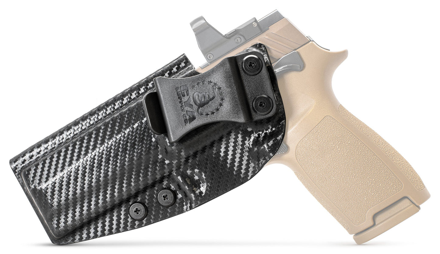 CYA Full size Holster in carbon steel with a black clip on a tan sig sauer p320 handgun