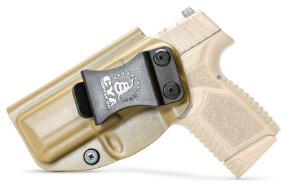 CYA flat dark earth Base IWB holster with a black belt clip on a cream fn reflex handgun